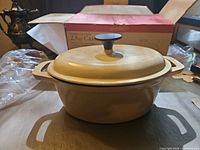 Casserole with lid on, box in background