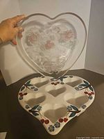 Both items: clear glass heart tray and ceramic muffin pan