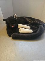 Full view of plush cat neck wrap curled