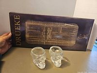 Boxed Drueke Four Track Cribbage board with two skull shot glasses
