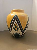 Front view of hand painted ceramic vase showing southwest pattern
