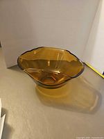 Side view of amber glass bowl showing color and shape
