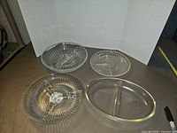All four clear glass divided dishes displayed together