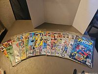 All 15 Thor comics fanned out on table