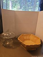 Overall lot view: glass pumpkin jar and ceramic bowl