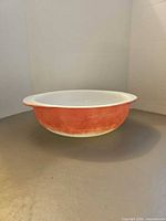 Side profile of orange Pyrex bowl