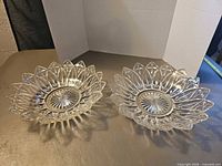 Both matching pressed glass bowls showing pattern and shape