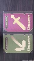 Front covers of both hardcover Minecraft handbooks