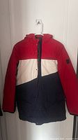 Front view showing colorblock design, hood, and overall condition