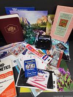 All items spread showing books, calendars, vase, desk holder, cards, tools, adhesives