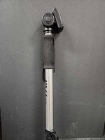 Full view of collapsed monopod showing foam grip and wrist strap