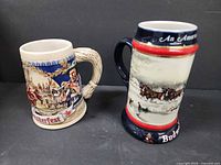 Two Budweiser steins side by side