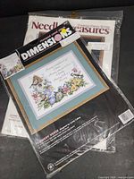 Both sealed cross stitch kits stacked