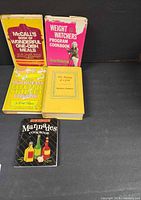 All five cookbooks displayed front covers