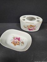 soap dish and toothbrush holder front view showing floral design and gold trim