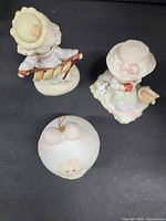 All three Precious Moments pieces grouped