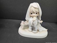 Front view of Precious Moments "June" figurine