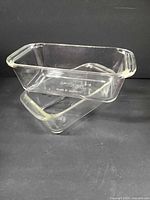 Two clear glass Pyrex loaf pans stacked