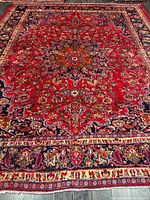 Full view of entire Mashhad rug showing borders and fringe