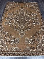 Full view of entire Persian rug showing overall design and colors