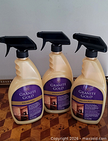 Front view of three Granite Gold Polish spray bottles