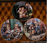 Front view of all three plates showing artwork and condition