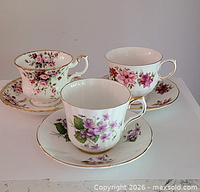 Three floral patterned Royal Albert teacup and saucer sets