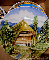 Relief chalet scene decorative plate