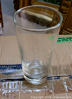Single clear glass tumbler standing upright