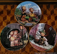 Front view of all three Hummel plates