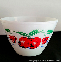 Side view showing apple and cherry graphics on bowl exterior