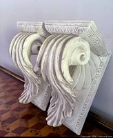Pair of plaster corbels angled view shows overall design