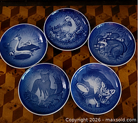 Front view of all five blue Royal Copenhagen animal plates