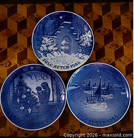 Front view of three Royal Copenhagen Christmas plates 1966 1981 1986