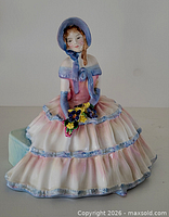 Front view of Royal Doulton Daydreams figurine showing dress, bouquet and bonnet