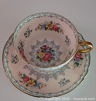 Top view of teacup nested in saucer showing pattern and gilt