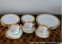 Full set laid out showing plates, platters, cups and saucers