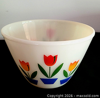 Side view showing tulip pattern on milk glass bowl