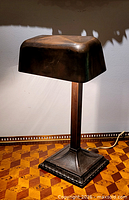 Front angled view of lamp showing shade, stem, base