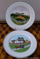 Both Naïf pattern plates displayed upright and flat to show designs and rims