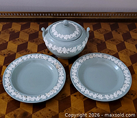 Overall view of sugar bowl with lid and two matching plates