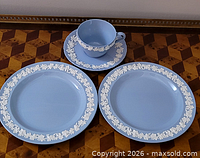 Set laid out showing teacup, saucer, two plates