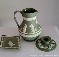 Overall view of pitcher, candlestick, and dish