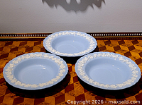 Three rimmed bowls top view showing color and relief border