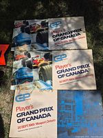 Three Player's Grand Prix of Canada advertising boards laid out on grass
