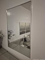 Full view of rectangular wall mirror on wall