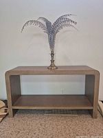 front view of tan console table with open shelf