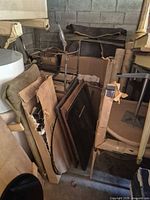 overview of stacked furniture parts, metal frame, wooden panels