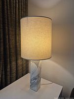 Lamp lit showing full height, shade and marble base