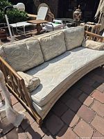 Front angled view showing full sofa, cushions, wood frame
